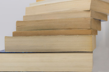 A pile of books, with white background