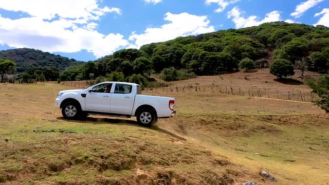 white pick up in mountain