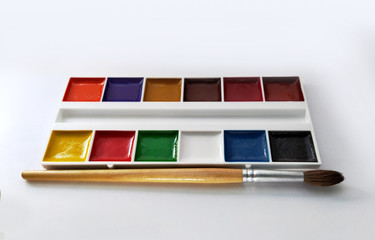 set of watercolor paints in white container
