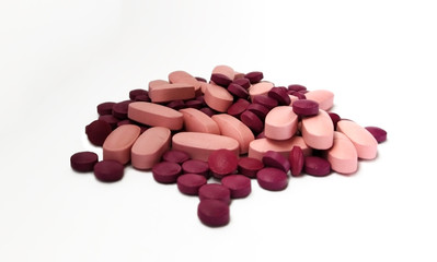 pink and purple pills. medicines isolated on white