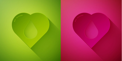 Paper cut Heart with water drop icon isolated on green and pink background. Paper art style. Vector Illustration.