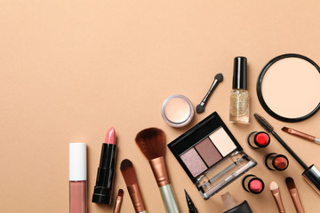 Different makeup cosmetics on brown background. Female accessories