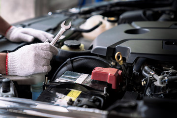 Auto mechanic working in the garage, Service and maintenance and car maintenance.