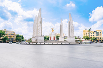 Fototapeta na wymiar Democracy monument with blue sky in Bangkok, Thailand. The Democracy Monument is a historical of constitution monument
