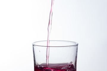 water falling into a clear glass