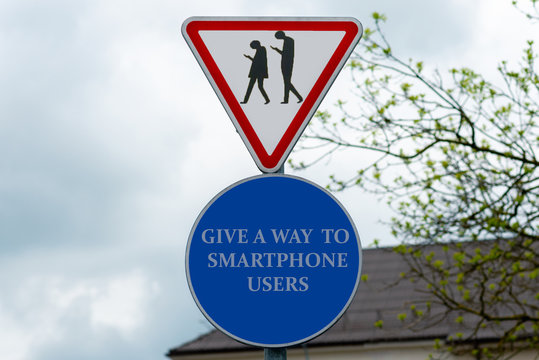 Parody caricature smartphone social networks degradation.signs with beware of smartphone users