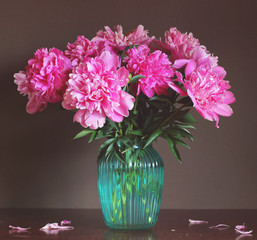 bouquet of pink peonies in a glass vase.