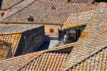stone roof tiles of historic houses in the city of Sorano in Tuscany, Italy.