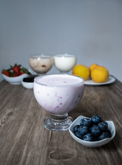 plain blueberry yogurt with fresh fruit on a plate
