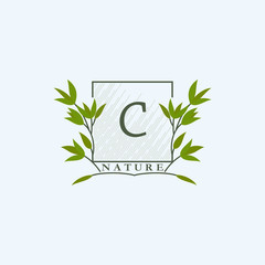 Green eco letters C logo with leaves in square shape. Initials with botanical elements with floral letter design for business identity style