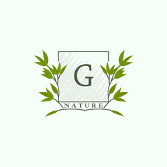 Green eco letters G logo with leaves in square shape. Initials with botanical elements with floral letter design for business identity style