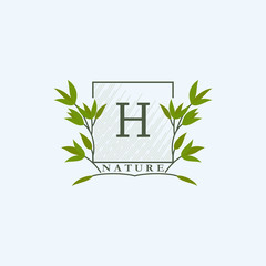 Green eco letters H logo with leaves in square shape. Initials with botanical elements with floral letter design for business identity style