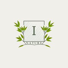 Green eco letters I logo with leaves in square shape. Initials with botanical elements with floral letter design for business identity style