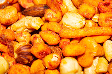 A mixture of different nuts. Healthy food, fitness diet. Surface texture. Close up.