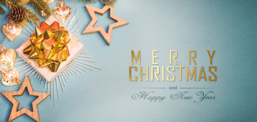 Christmas composition. Gifts, fir tree branches, decorations on holiday background. Christmas, winter, new year concept.