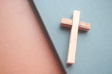 wooden cross on a wooden background