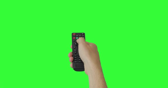 Isolated Male hand with TV remote pressing button and changing, switch channels. Green screen. Place for your advertisement. Pack of Gestures. Using a remote control over keyed chroma key background
