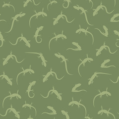 The seamless pattern with the green silhouettes of lizards