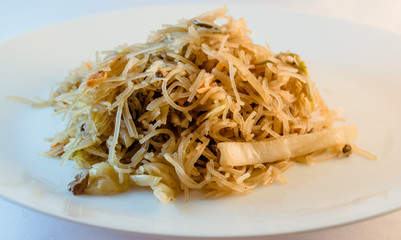 Image of the home-made chicken string fry noodle a typical Asian cuisine in a close-up view.