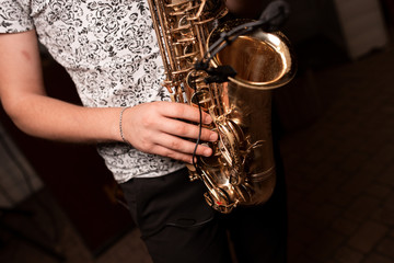 saxophone in the hands of a man