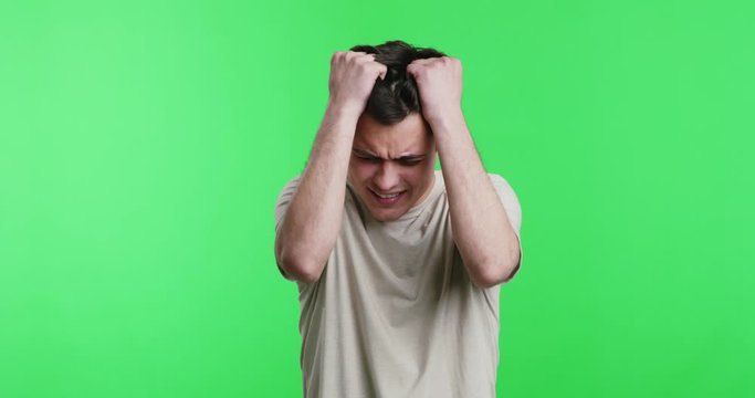 Desperate Guy With Problems Pulling His Hair Out