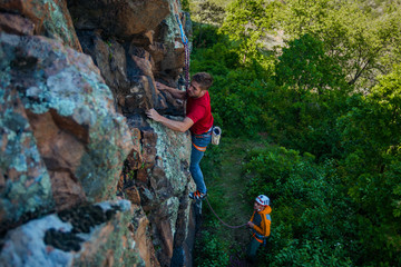 Climbers training on rock wall