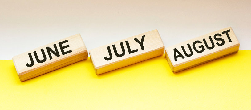 on wooden blocks text june july and august