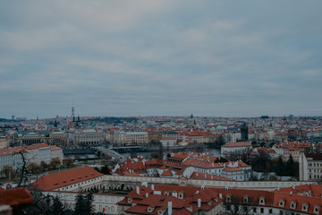 Fototapeta na wymiar top view on gloomy Prague old beatiful roofs