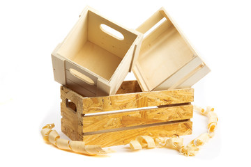 small wooden packing crates or boxes and wood shavings isolated on white
