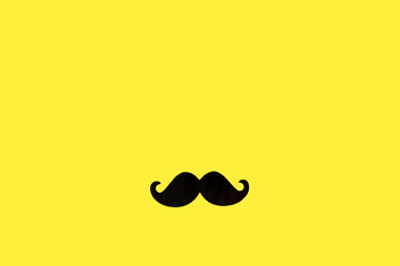 Father's day concept. Black moustache paper background.