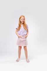 cute red-haired girl in casual clothes smiling