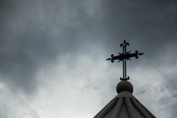 church cross under abstract  sky