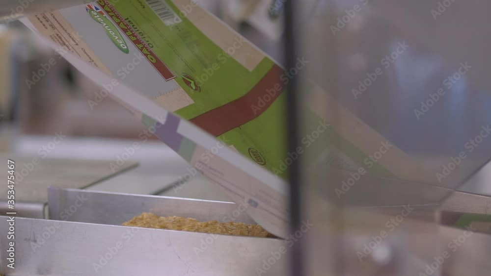 Poster automated packaging and labelling is used to seal cakes ready for distribution in a food factory