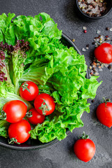 salad vegetables, lettuce and tomato Menu concept. food background top view copy space for text healthy eating keto or paleo diet organic