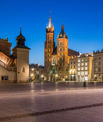 Main market square and St Mary's church in the night, Krakow, Poland