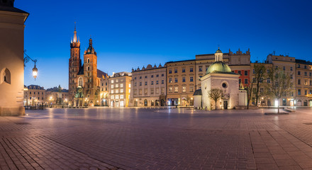 Fototapeta na wymiar Krakow, Poland, main square night panorama with Cloth Hall and St Mary's church