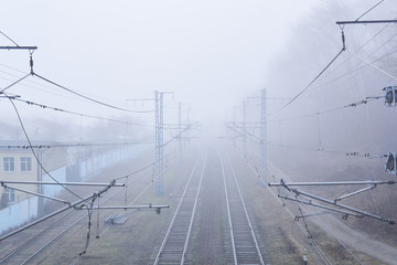 railroad rails lurking in fog