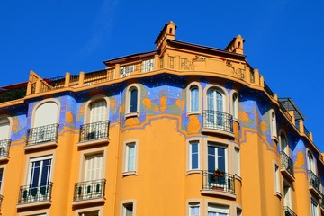Fototapeta na wymiar Decorated building in the Musiciens district in Nice, France
