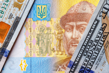 Ukrainian money - hryvnia banknotes USA dollars bills. Finance in Ukraine, of the hryvnia to the dollar exchange rate. World economic crisis associated with coronovirus.