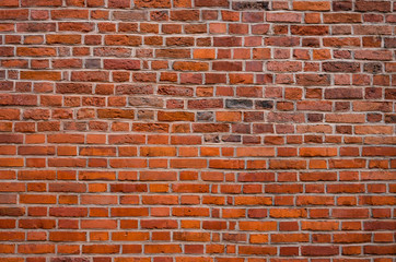 Fototapeta premium Weathered red brick wall background, texture