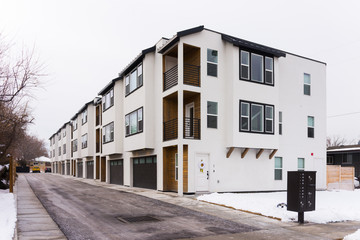 White and wood modern apartment building