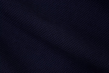 Obraz premium Blue background of fabric from a piece of crumpled clothes. Top view. crumpled polyester. The texture of the fabric, useful as a backdrop.