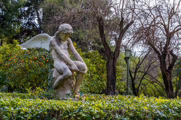 Athens, Attica / Greece. "Eros breaks his bow". The statue is located in the park of Zappion Hall. It was made of marble in 1896 