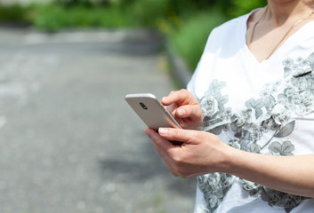woman hand phone in street
