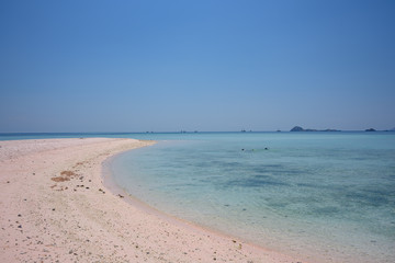 Taka Makassar Island, small sandbar within Komodo National Park. Clear turquoise water and pink sands.