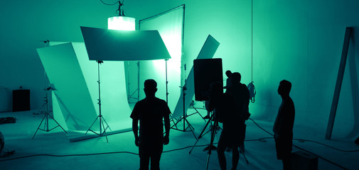 Shooting studio for photographer and creative art director with production crew team setting up...