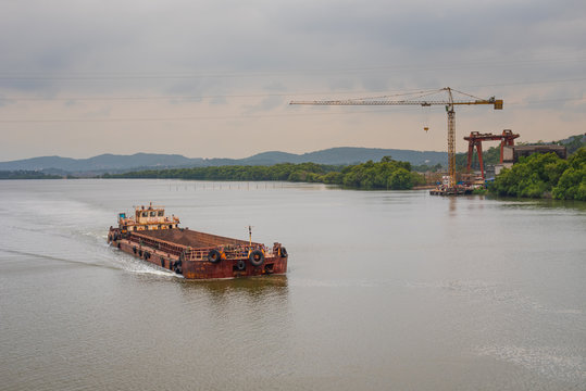Borim,Goa/India- May 1 2020: Barges carrying mining ore for export at Borim, Goa.