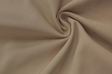 Shiny plain cream colored polyester fabric