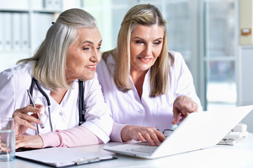 Fototapeta premium Portrait of doctors at work in hospital