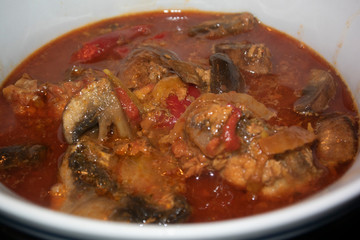 close up red spicy curry